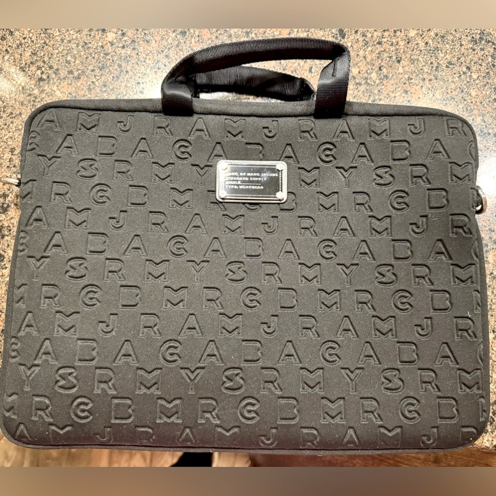 Mark Jacobs, black neoprene laptop bag w/ canvas carry strap.